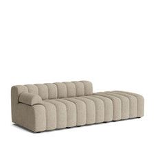 a beige couch sitting on top of a white floor