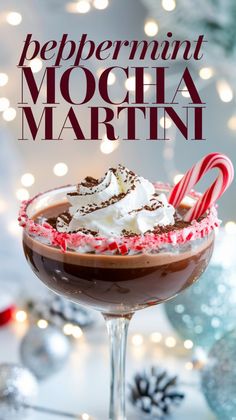 peppermint mocha martini in a glass with candy canes and whipped cream