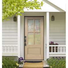 the front door of a white house with a sign on it that reads 5410