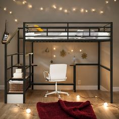 a loft bed with a desk underneath it and lights on the wall behind it in a bedroom