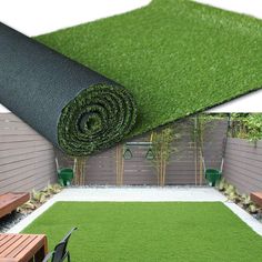 an artificial grass mat in the middle of a backyard