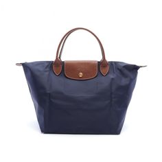 Used Longchamp Le Pliage Original M Tote Bag, Nylon Leather, Women's, Navy, Brown, L1623089p68 (Sku: Gzl13xes) === General === Brand : Longchamp === Design === Type : Tote Bag Material : Nylon , Leather Color : Brown, Navy Gender : Women === Size === Size (Hxwxd) : 28cm X 29cm X 16cm / 11.02'' X 11.41'' X 6.29'' === Included Items === Accessories : None Accessories Notice : Before Purchasing, Please Refer To The Images Of The Accessories Included With The Item. === Condition === Condition : New Classic Navy Shopping Bag, Packable Double Handle Bag, Classic Navy Bags With Detachable Handle, Nylon Bags With Leather Trim, Classic Packable Bags For Travel, Packable Leather Bag For Daily Use, Luxury Packable Bags For On-the-go, Navy Travel Bag With Detachable Handle, Classic Nylon Shopping Bags