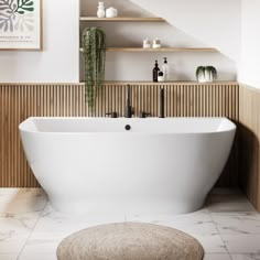 a white bath tub sitting next to a wooden shelf