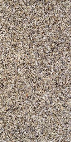 a close up view of the surface of a granite flooring material with various colors and sizes