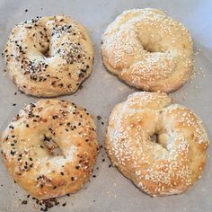 four bagels with sesame seeds and poppy seed sprinkles