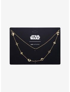 the star wars necklace is shown in gold