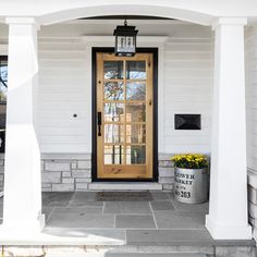 a front door with a lantern on it