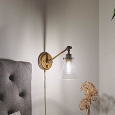 Timeless, versatile, and elegant, the Rosewood 1 light plug-in wall sconce in natural brass updates the traditional, instantly adding dimension and style to your space. A DIYer's dream, plug-in wall lights make installation as easy as hanging up a picture on the wall. You just need a few tools and an outlet; it's as simple as that. The option to plug in the light makes updating various locations in a home, condo, or apartment a breeze. Create that cozy reading nook you've been dreaming about or shine a light (or two) on your new home office, gym, or craft room. Equally functional and stylish, the arms on Rosewood sconce lighting move up and down while its shade swivels left, right, up, and down, allowing you to customize the angle and direction of light. Its clear shade adds an ambient glo Wall Mount Lights Bedroom, Bedside Lighting Wall Mounted, Wall Mounted Lights Bedroom, Picture On The Wall, Plug In Wall Lights, Reading Wall, Office Gym, Bedside Lighting, Cozy Reading Nook