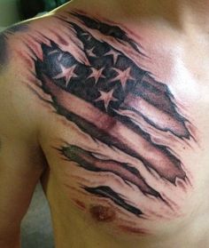 a man's chest with an american flag tattoo on it, and stars in the background