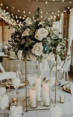 a table with candles and flowers on it