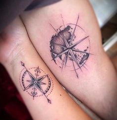 two people with tattoos on their legs and one has a compass tattoo on the leg