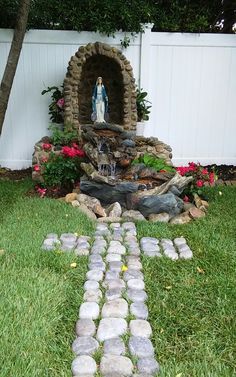 there is a small fountain in the yard