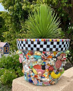 a potted plant sitting on top of a cement block