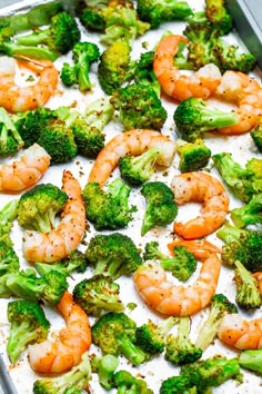 broccoli and shrimp are being cooked in a baking pan on the stovetop