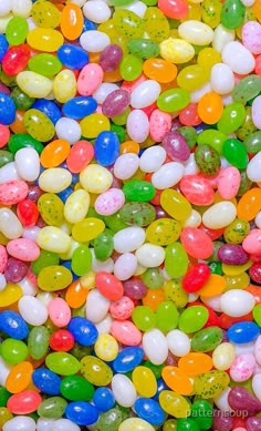 many different colored candies are scattered together