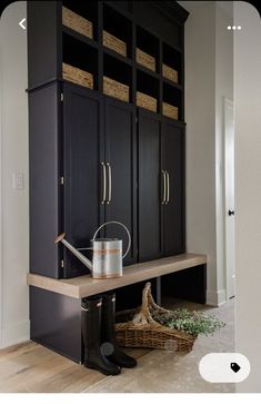 a room with some cabinets and a bucket on the table