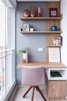 a home office with wooden shelves and pink chair in front of the desk on the balcony