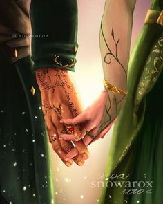 two people holding hands with tattoos on their arms