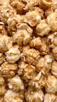 a pile of caramel popcorn sitting on top of a table