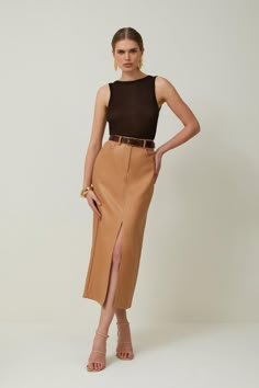 Allow This Closet Staple To Provide An Instant Update To Everyday Rotations. Crafted With Premium Leather, This Midi Skirt Emsuspenders An Off-Duty Aesthetic, While Corset-Style Seaming Adds Dimension To The Piece. Belt Loops And Lapels Add Understated Detailing This Piece. Style This Skirt With Heels And A Crop Top To Exude Understated Elegance At Your Next Event.Midi Hemlineleatherfront Leg Slitzip Fastening Camel Leather Pencil Skirt, Bodycon Skirt Midi, High Pencil Skirt, Mid Length Skirt Classy, Fall Pencil Skirts, Leather Pencil Skirt Midi, Midi Skirts Work, Pencil Skirt Heeled Boots, Semi Formal Skirts For Women