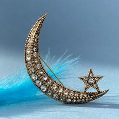 ● Are you looking for the perfect gift for yourself or your loved one? Our Crescent and Star Brooch, designed with crystal stones on bronze, may be the perfect choice for you. ● This Crescent and Star brooch is inspired by the Moon that illuminates us at night and the Stars that shine brightly in the sky, and is decorated with crystal stones on bronze. Its width is 4 cm and its height is 6.5 cm, which makes it a statement piece that adds elegance and sophistication to any outfit. ● Our product design is a product of Tansel Baybara's Diplomatic Heritage Collection. The brooch is meticulously handcrafted and the white crystal stones are hand-set by women, making our brooch a perfect piece of jewellery. ● Your Crescent and Star Brooch will arrive in a special velvet box, ready to be given as Stars Jewelry, Wedding Brooches, Star Brooch, Wedding Brooch, Crystal Stones, Star Jewelry, Crystal Brooch, Heritage Collection, White Crystal