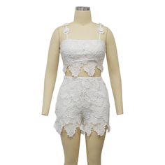 Indulge in luxury with our Feminine Lace Applique' Shorts Set. Featuring delicate lace appliques, this set exudes elegance and sophistication. Perfect for a romantic evening or a special occasion, this set will make you feel confident and stylish. Elevate your wardrobe with this exclusive piece. Sizes S-2XL Decoration Zip Up , Lace Length Above Knee, Mini Style Sexy & Club Fabric Type Blended fabrics , Lace Material Polyester , Spandex Neckline Strappy Pattern Type Solid Sleeve Length Sleeveless Season Summer Fabric Non-Stretch Fitted Sleeveless Lace Set, White Lace Party Set, White Lace Sets For Summer, Elegant Lace Sets For Night Out, Summer Party Lace Sets, Fitted Lace Summer Sets, Lace Sets For Spring Parties, Lace Party Set With Lace Work, Spring Party Sets With Lace Trim