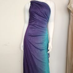 Add A Touch Of Glamour To Your Wardrobe With This Stunning Purple And Ombre Blue Formal Dress By Betsy & Adam. The Dress Is Fashioned With An Asymmetrical Sleeve, A One-Shoulder Neckline, And A Long Body Con Dress Silhouette That Gracefully Falls To The Floor. It Also Boasts A Beautiful Glitter And Rhinestone Accent That Sparkles In The Light, Making You The Center Of Attention At Any Formal Occasion. The Dress Is Perfect For The Winter Season And Is Available In A Size 2. The Dress Features A Zip Closure And Comes In Solid Pattern, Sleeveless, And A-Line Style. It's Suitable For Any Formal Occasion, Whether It's A Wedding, Prom, Or Gala. Shop This Gorgeous Dress Now And Make A Statement A Tie Dye Formal Dress, Long Body Con Dress, Purple Formal Dress, Blue Formal Dress, Ombre Prom Dresses, Blue Dress Formal, Teal Dress, Body Con Dress, Vintage Style Dresses