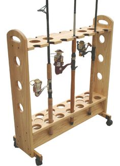 a wooden rack with fishing rods and reels attached to the sides, on wheels