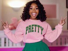 This stylish sweatshirt is perfect for Alpha Kappa Alpha Sorority, Inc. members! Featuring a chic salmon pink base with bold apple green varsity letters spelling "PRETTY" across the front, this sweater is a must-have for any AKA sister. The sweatshirt is designed with comfort in mind, providing a relaxed fit and cozy feel for everyday wear or special AKA events. For those who prefer a different color combination, this sweatshirt is also available in green with pink varsity letters. Whether you're attending a chapter meeting, a community event, or just looking to rep your sorority with pride, this sweatshirt combines both style and spirit. Details: *Available in two color combinations: 1.Salmon pink with apple green varsity letters 2.Apple green with salmon pink varsity letters *High-qualit Aka Aesthetic, Alpha Kappa Alpha Sorority Gifts, Aka Alpha Kappa Alpha, Graduation Look, Varsity Letters, Divine Nine