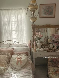 a bed room with a neatly made bed next to a dresser and a mirror on the wall