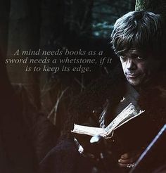 a man holding a book in his hands with a quote from game of thrones