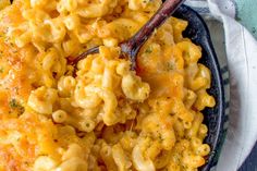 a bowl filled with macaroni and cheese on top of a table