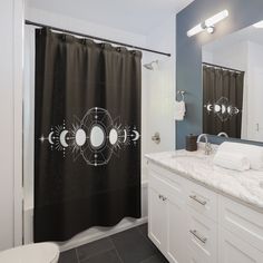 a black and white shower curtain in a bathroom