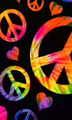 tie dye peace signs and hearts on a black background