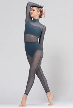 a woman in black bodysuit with sheer mesh on the sides and leggings