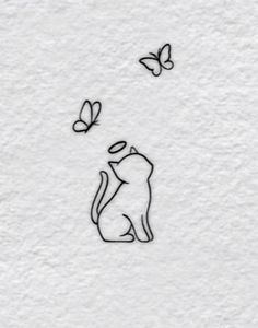 a drawing of a cat and butterflies on a white paper with the words, i love you