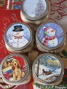 four tins with christmas images on them