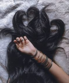 a woman's hand on top of her hair