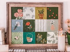 a wooden frame with flowers and vases painted on it