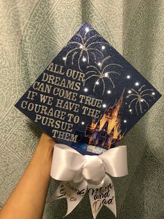 someone is holding up a graduation cap that says, all our dreams can come true if we have the courage to pursue them