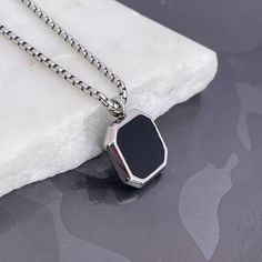 "Elevate her style with our Black Onyx Stone Necklace for Men, a stainless steel pendant ready for custom engraving. The perfect gift designed for her, these handmade jewelry pieces add sophistication to any look. Express your love with a special message, initials, or date, and make it a special treasure. Convey individuality and charm with a timeless piece. Presented in a durable and stylish style, this makes a lovely Valentine's Day gift for a husband or lover. \"Personalize Your Style\" and m Elegant Stainless Steel Necklace For Father's Day, Personalized Black Metal Necklaces, Minimalist Stainless Steel Dog Tag Necklace, Minimalist Stainless Steel Necklace For Father's Day, Stainless Steel Necklace With Rectangular Pendant And Box Chain, Stainless Steel Box Chain Necklace With Square Pendant, Classic Stainless Steel Necklace With Polished Finish, Minimalist Gunmetal Necklace For Gift, Minimalist Gunmetal Jewelry For Gifts