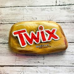 a rock with the word twix painted on it