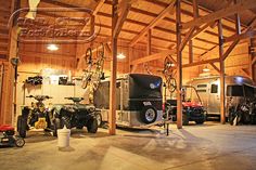 an indoor garage with several vehicles in it