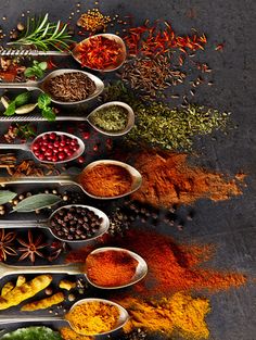 an assortment of spices and herbs arranged in the shape of a pyramid