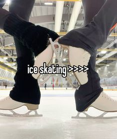 someone is skating on an ice rink with their feet touching each other's legs