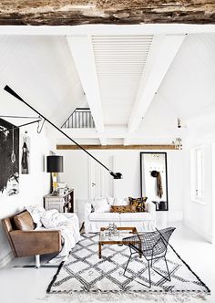 a living room filled with furniture and decor