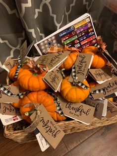 a basket filled with lots of pumpkins and price tags on top of each one