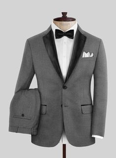 Make an impression at the office or your next formal gathering in our Napolean Gray Wool Tuxedo Suit. Crafted from wool blend, our suit is rendered in soft, wool-rich fabric and finished in a classic gray shade, making you a complete gentleman that grabs attention for his styling.  Featuring satin lapel, matching satin covered buttons and gentle texture at its surface, our tuxedo is a subtle fashion-forward take on a traditional tailoring.  Look Includes   Napolean Gray Wool Fabric  Two Button T Tailored Gray Tuxedo Blazer, Tailored Gray Tuxedo In Suiting Fabric, Gray Tailored Tuxedo For Work, Tailored Gray Blazer, Tailored Gray Tuxedo For Formal Occasions, Semi-formal Gray Tuxedo With Notch Lapel, Gray Tuxedo Suit For Formal Occasions, Gray Notch Lapel Tuxedo For Semi-formal Events, Gray Tailored Tuxedo Suit