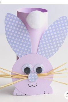 an easter bunny made out of toilet paper and straws with eyes on it's head