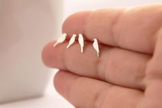 This set of four tiny bird stud earrings will make a wonderful addition to your eclectic wardrobe:) This is a mismatched set, so you can mix and match for a whimsical look. Each little bird measures between 8-10 mm in length and approx. 3-4 mm in width. They have been hand sawn from Australian sterling silver. hand finished and hand polished. A gorgeous gift for your special person. You will receive four mixed birds as pictured, please note as they are hand made, one at a time, there may be very Mismatched Stud Earrings, Cool Stud Earrings, Eclectic Wardrobe, Earrings Bird, Quirky Earrings, Silver Bird, Jewelry Cute, Tragus Piercing, Tiny Bird